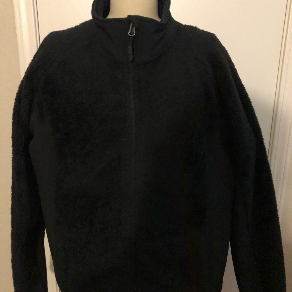 Black XL fleece and scuba stretch fabric on sides and high collar. Comfortable